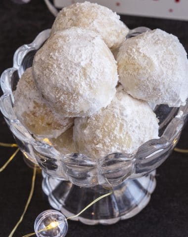 snowball cookies in a glass bowl