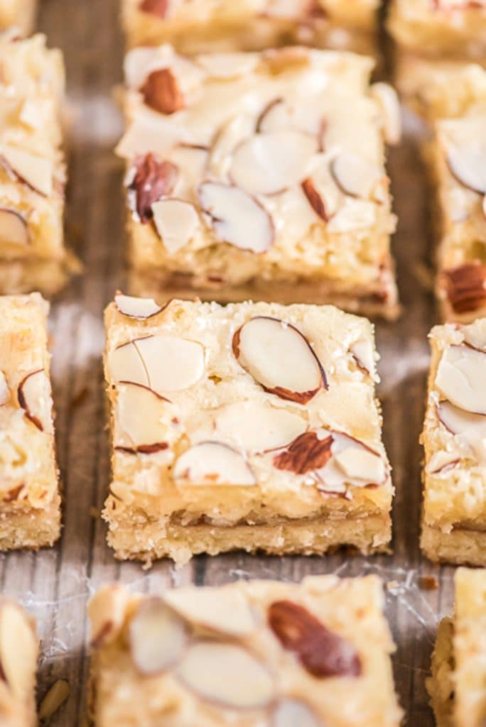 Almond bars on a wooden board.