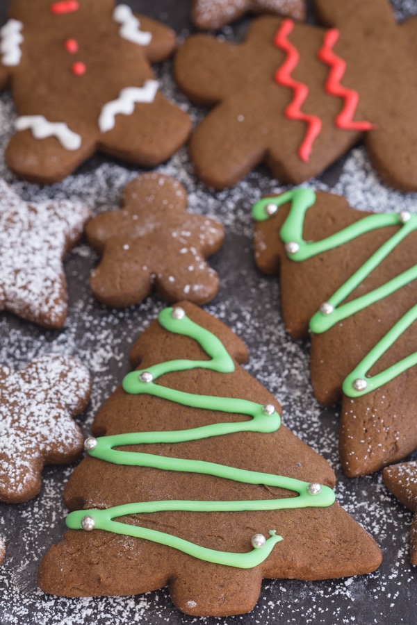 decorated gingerbread cookies on a black board