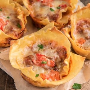 Lasagna cups on a board.