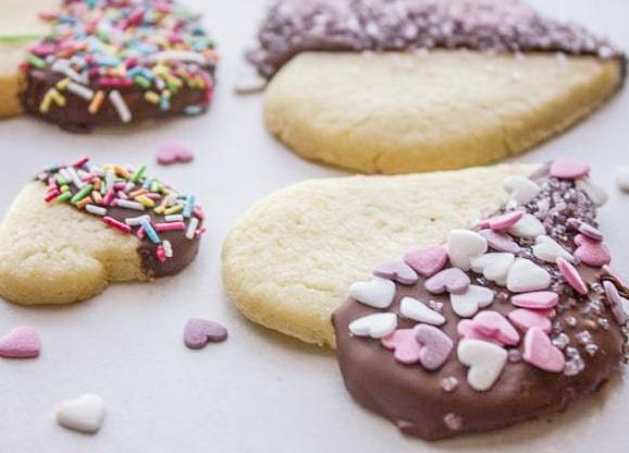close up chocolate dipped heart cookies 