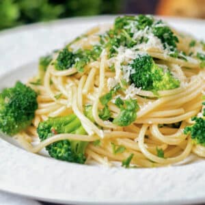 Broccoli pasta on a white plate.