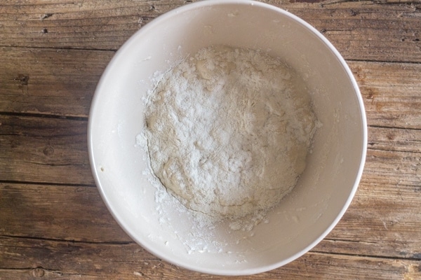 the ingredients mixed with flour sprinkled on top to make ciabatta bread