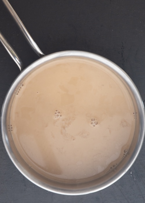 Milk, cream and coffee in a pot.