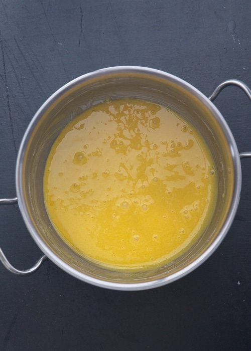 Egg yolks, sugar and flour mixed in a pot.
