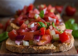 tomato bruschetta on toasted bread up close photo