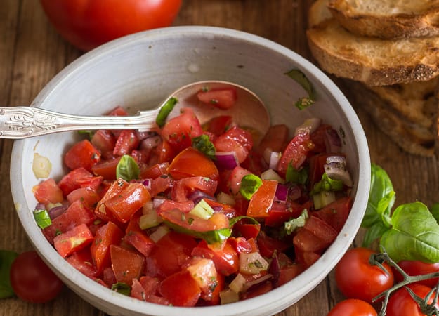 tomato bruschetta in a white bowl