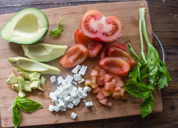 Easy Tomato Avocado Feta Bruschetta a simple & fast appetizer. Fresh ingredients, olive oil and balsamic make this a delicious healthy recipe .