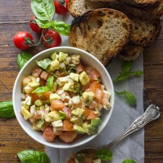 Easy Tomato Avocado Feta Bruschetta a simple & fast appetizer. Fresh ingredients, olive oil and balsamic make this a delicious healthy recipe .