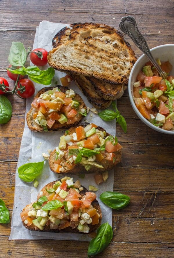 Easy Tomato Avocado Feta Bruschetta a simple & fast appetizer. Fresh ingredients, olive oil and balsamic make this a delicious healthy recipe .