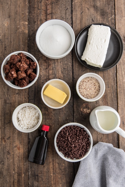Ingredients for the brownie parfait on a brown board.