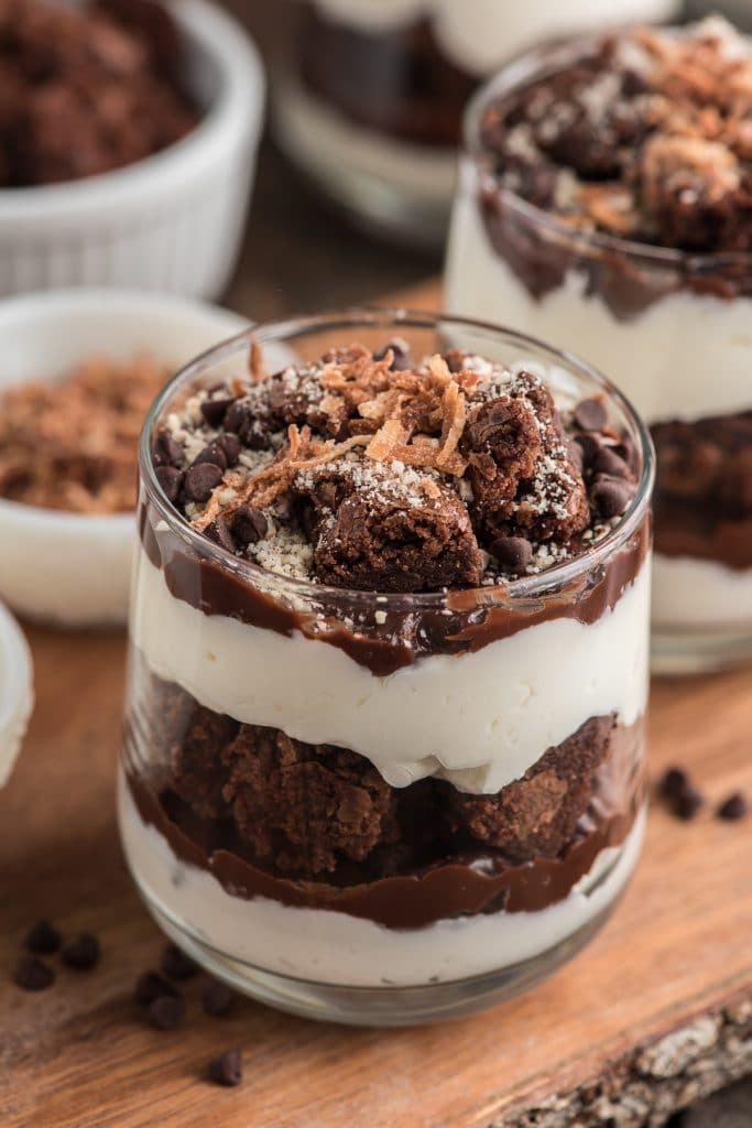 Brownie parfait on a brown board.