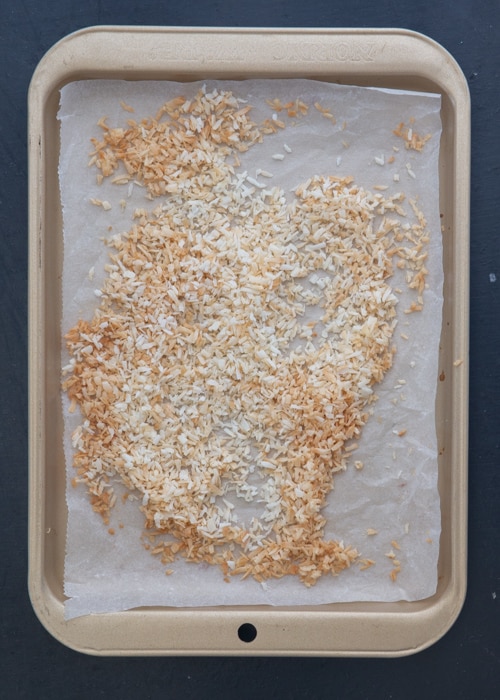 The toasted coconut on baking sheet.