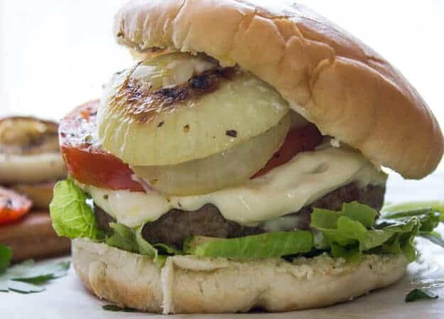 Parmesan Crusted Burgers with Grilled Onions and Tomatoes, your next burger just got amazing, delicious juicy patties and grilled veggies.