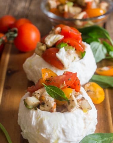 stuffed fresh mozzarella caprese on a board