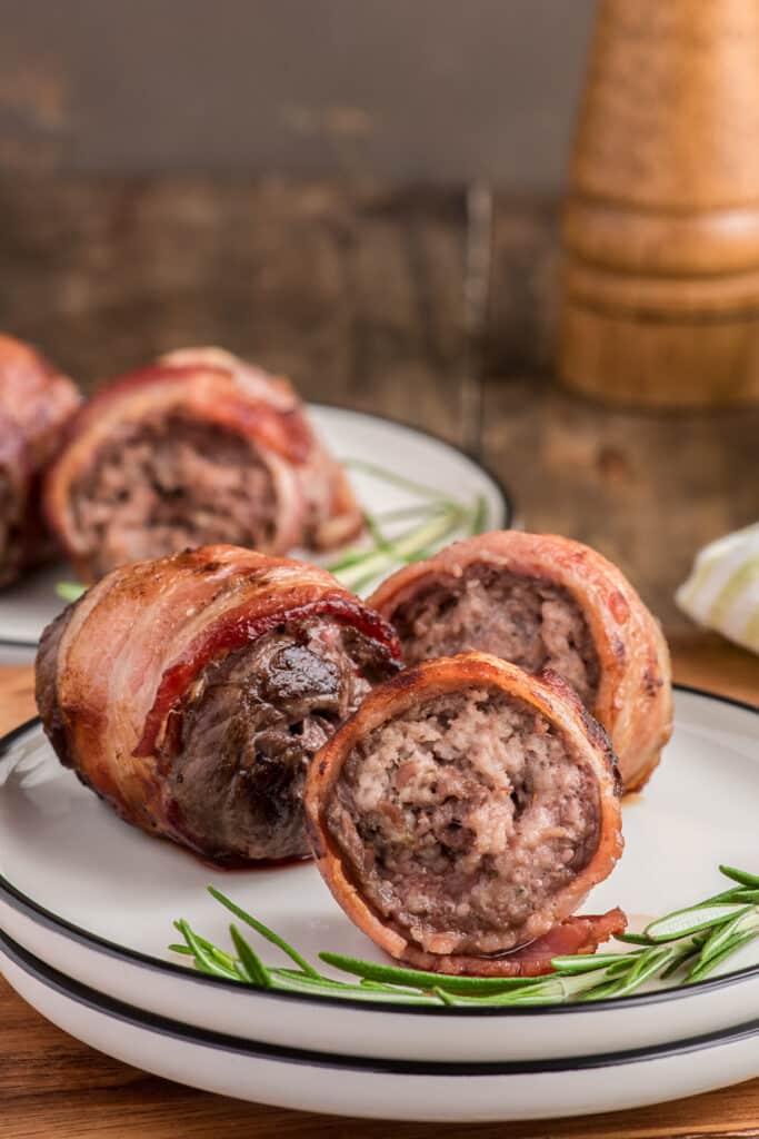 Grilled beef rolls on a plate.