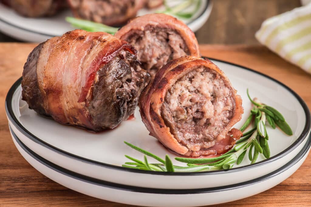 Grilled beef rolls on a plate.