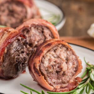 Grilled beef rolls on a plate.