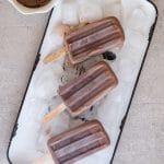 fudgesicles on a white tray with ice cubes