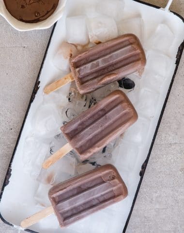 fudgesicles on a white tray with ice cubes