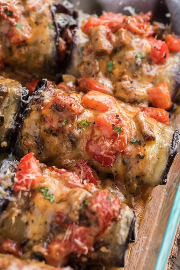Baked vegetable eggplant rolls in a baking dish.