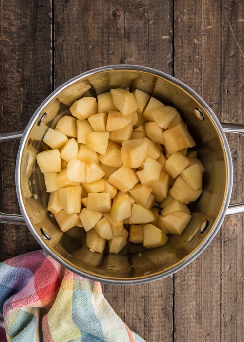 Apples chopped in a pot.