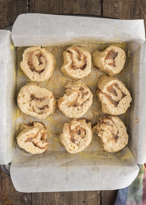The unbaked cinnamon rolls in the pan.