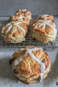 hot cross scones on a wire rack