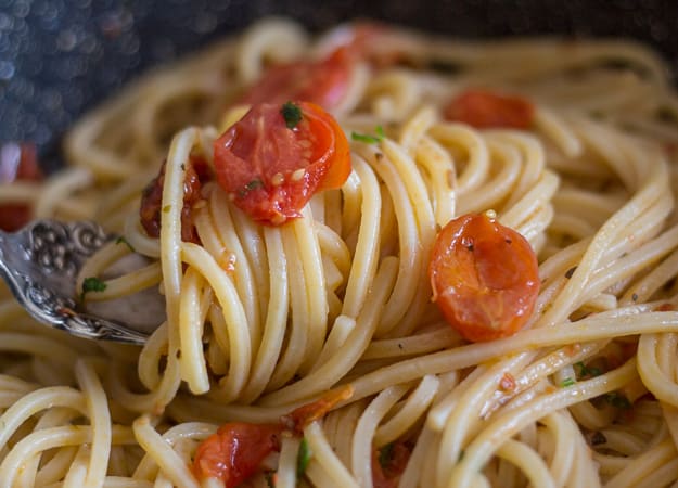 spaghetti and anchovy on a fork