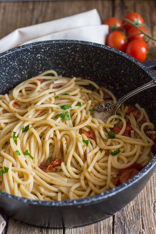 anchovy pasta in a black pan