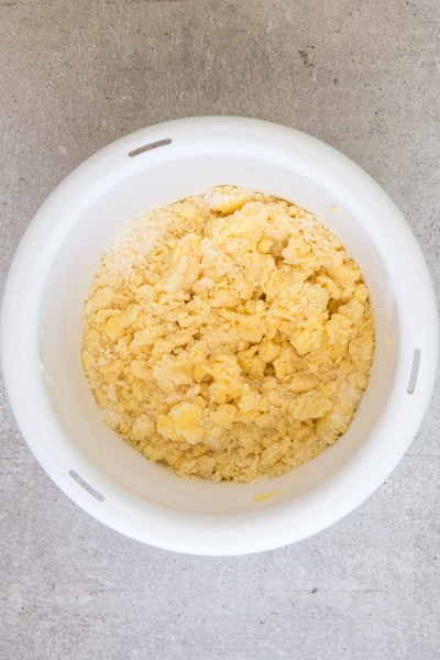 mixing the flour mixture into the creamed eggs and butter