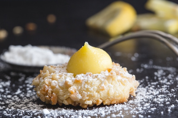 lemon thumbprint cookie dusted with powdered sugar