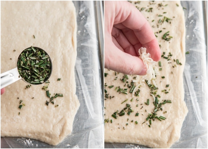 Sprinkling rosemary, salt and parmesan cheese on the pizza dough.