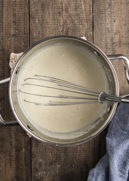 The white sauce in a pot.