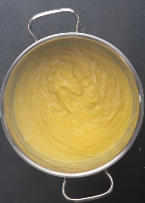 The pastry cream thickened in the pot.