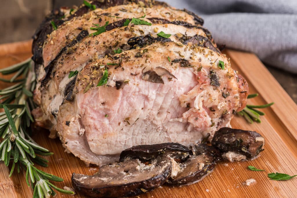 Hasselback pork on a wooden board