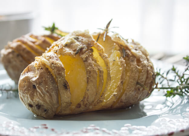 Easy Baked Italian Spiced Parmesan Hasselback Potatoes, the perfect side dish Potato recipe, perfectly spiced and cheesy.