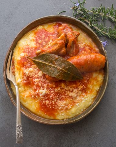 A creamy Traditional Polenta, served with a delicious Sausage Pork Rib Tomato Sauce Recipe, Italian Comfort Food at it's best.
