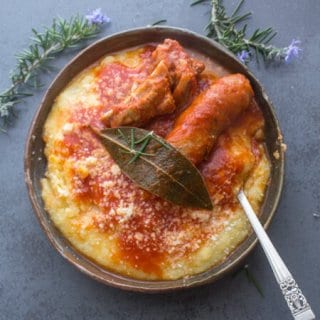 A creamy Traditional Polenta, served with a delicious Sausage Pork Rib Tomato Sauce Recipe, Italian Comfort Food at it's best.