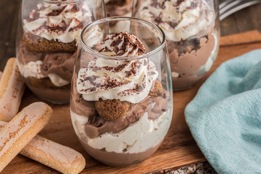 Three chocolate tiramisu in glasses.