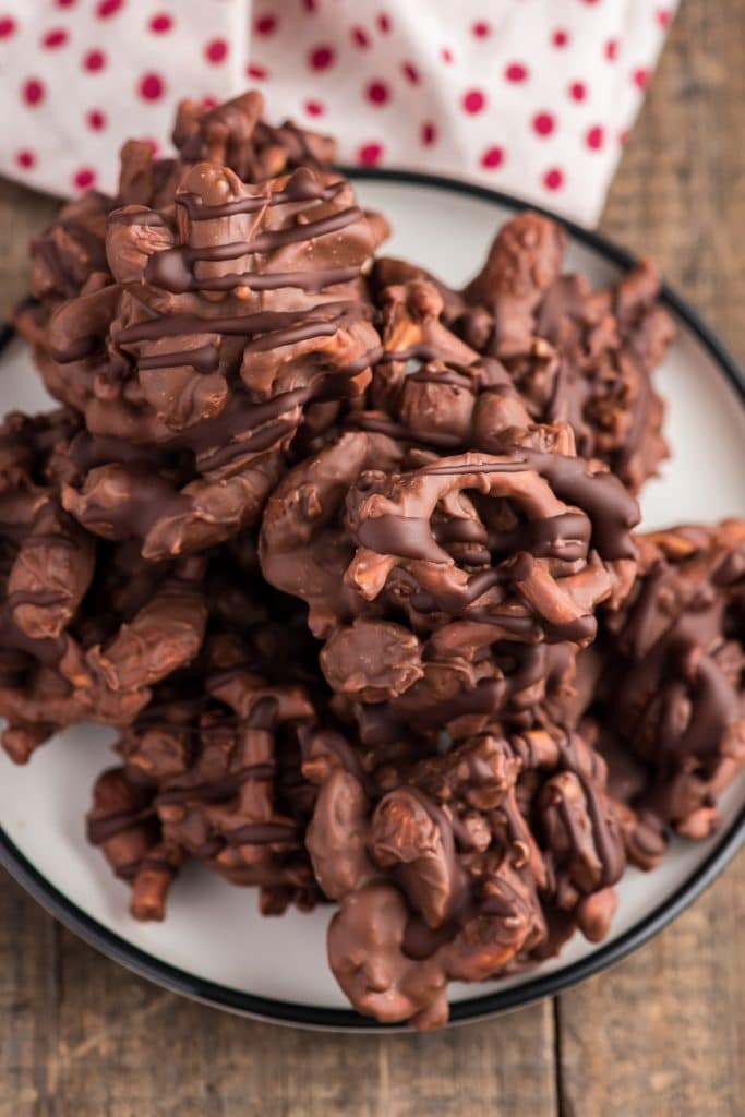 Chocolate clusters on a white plate.