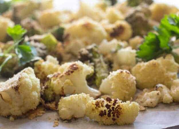 Crusty Parmesan Roasted Cauliflower, a yummy , tasty blend of roasted cauliflower topped with parmesan cheese, breadcrumbs and spices.