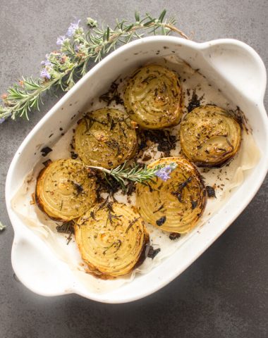 Rosemary Roasted Onions, whole roasted onions sprinkled with rosemary & spices and drizzled with olive oil. So yummy.