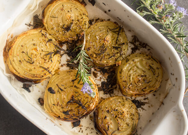 Rosemary Roasted Onions, whole roasted onions sprinkled with rosemary & spices and drizzled with olive oil. So yummy.