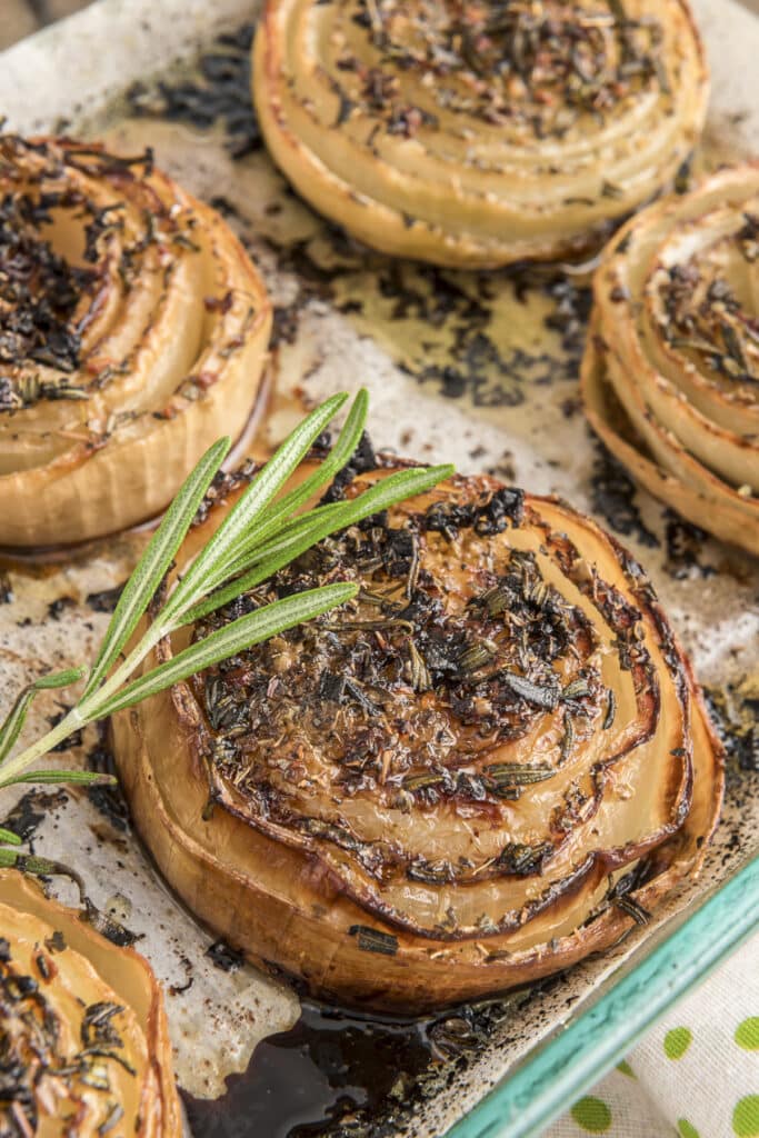 Roasted onions in a glass dish.