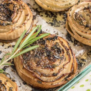 Roasted onions in a glass dish.