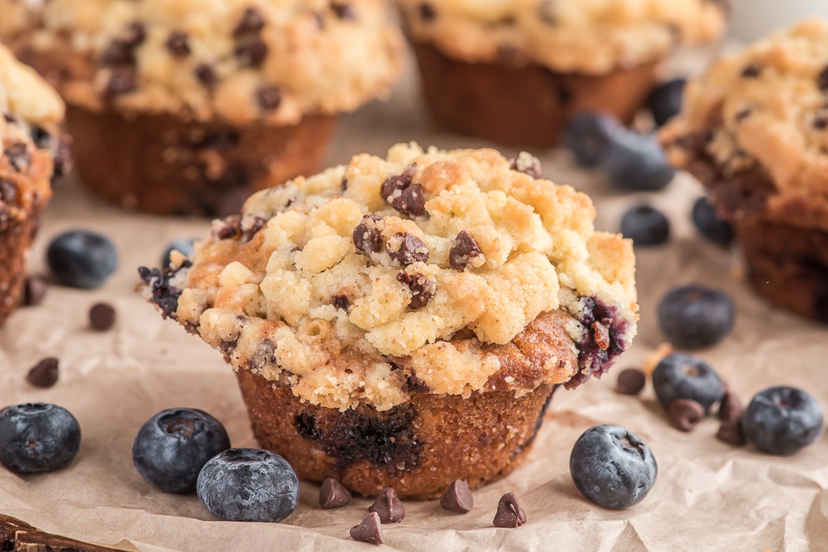 Blueberry muffins on brown paper.