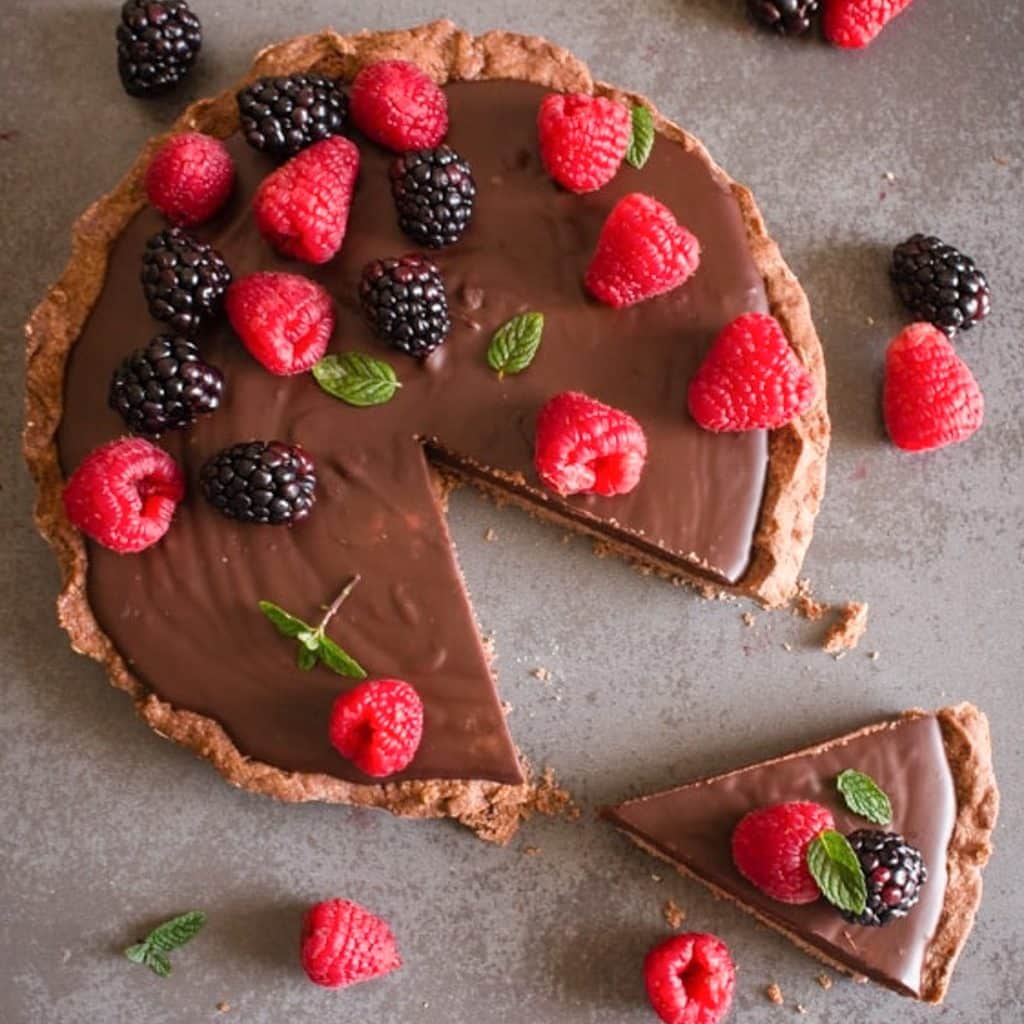 Chocolate pie with a slice cut.