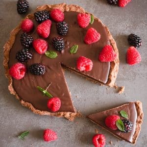 Chocolate pie with a slice cut.