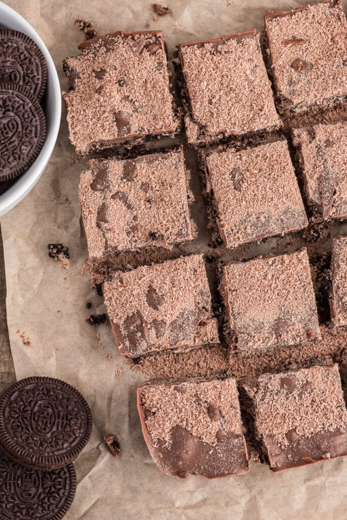 Cookie bars on brown paper.